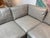 A luxurious Bernhardt leather sectional upholstered in supple dove-gray leather with elegant nailhead trim and rolled...