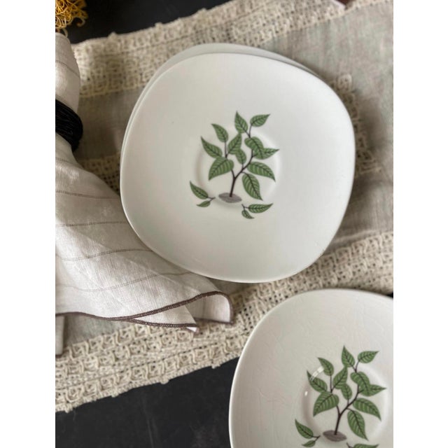 Wonderful, set of seven mid-century modern saucer plates, presented on a soft white, With a central pattern called Coffee...