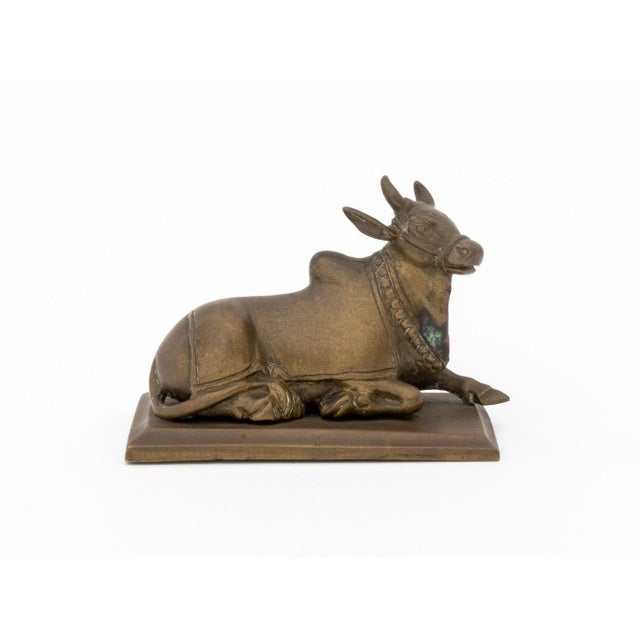 Indian Seated Bull Brass Sculpture, 19th century or earlier, mounted on a rectangular base. Overall: 3" H x 4" W x 2" D....