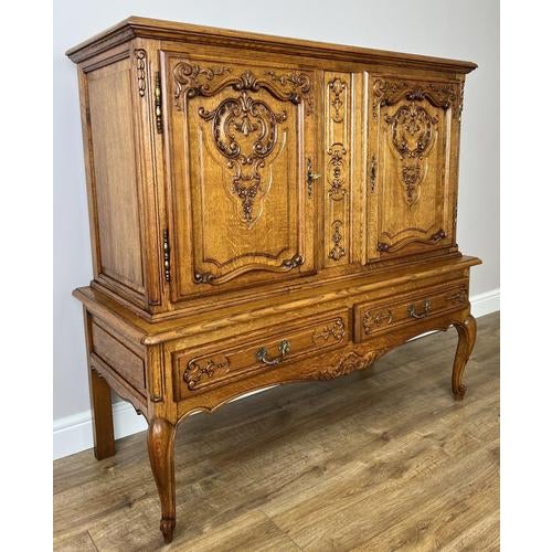 An impressive Vintage French Louis cabinet , beautifully crafted with intricate carvings and elegant proportions that...