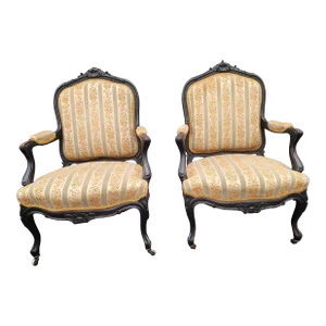 Pair of 1890s Louis XV Carved, Ebonized and Upholstered Bergere Arm Chairs