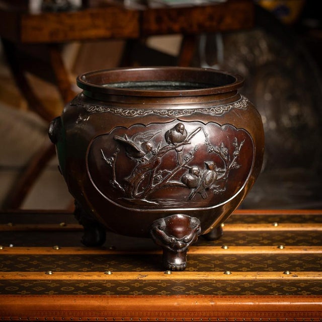Antique 19th Century Japanese Meiji period large bronze mythological jardinière. Raised on three tall feet formed as...