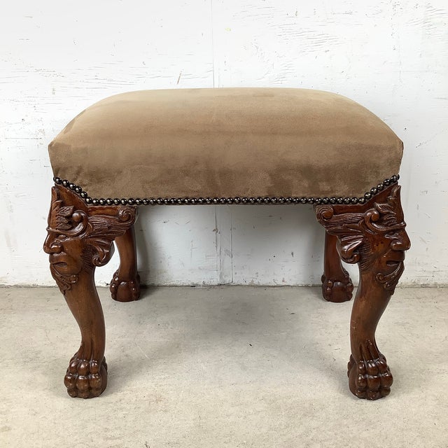 This striking footstool features dramatic carved grotesque mask knees, a hallmark detail drawn from the Gothic Revival and...