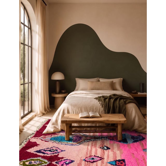 Contemporary Moroccan Rug | Handwoven Berber Wool Rug with Pink Field and Abstract Jewel-Toned Motifs This whimsical...