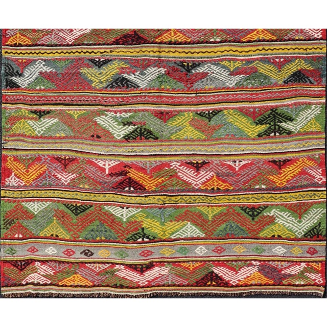Bright colorful vintage Turkish hand woven embroidered kilim with all-over tribal motif design. Keivan Woven Arts / rug...