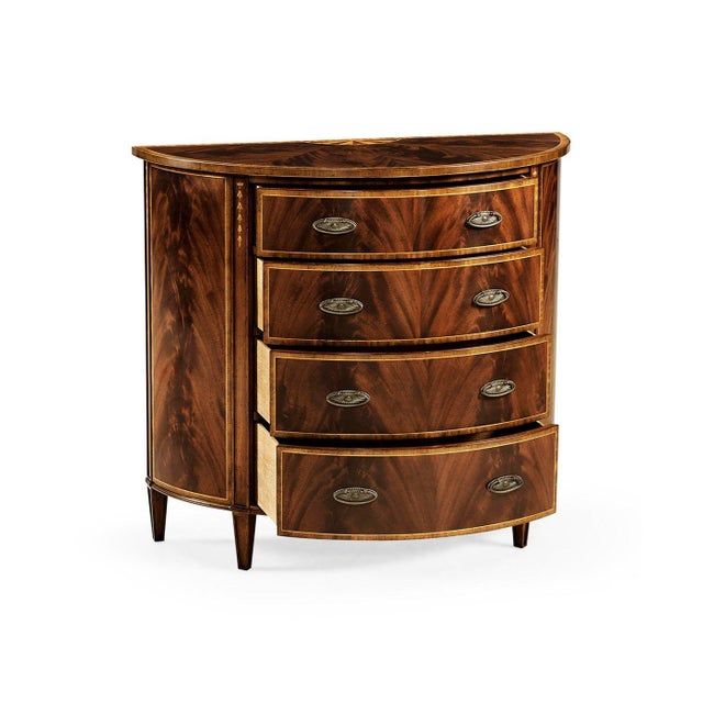 The Georgian Demilune Chest of Drawers in the George III Hepplewhite style shows the elegance of late 18th-century design....