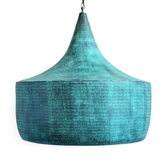 Hand pounded copper lantern with beautiful verdigris patina on the exterior with true copper finish on the interior. The...