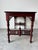 A beautifully crafted vintage Chinese console table made from solid mahogany, showcasing elegant hand-carved details and...