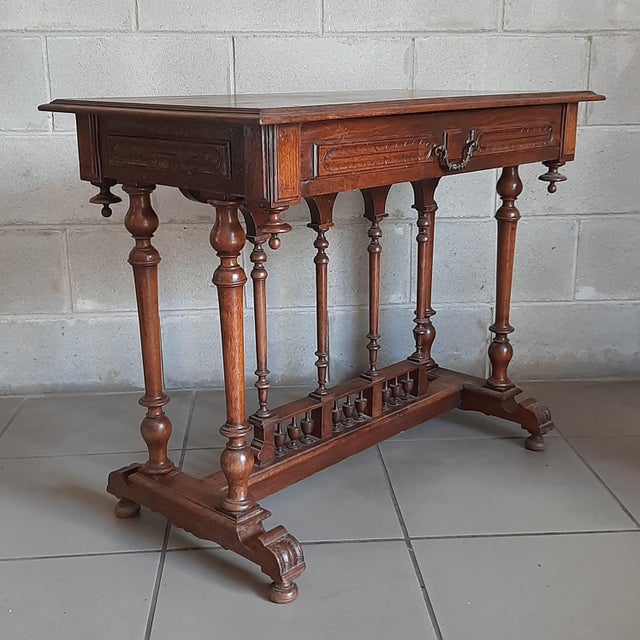 Wonderful antique rectangular Enrico II coffee table, handcrafted in walnut-colored wood, with fine decorations and...