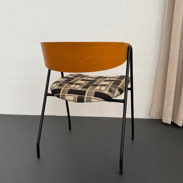 This mid-century modern compass chair is a wonderful combination of materials that exudes charm from every angle. The...