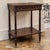 Refined French Louis XVI style gives this mid-century mahogany end table its timeless appeal. The clean neoclassical...