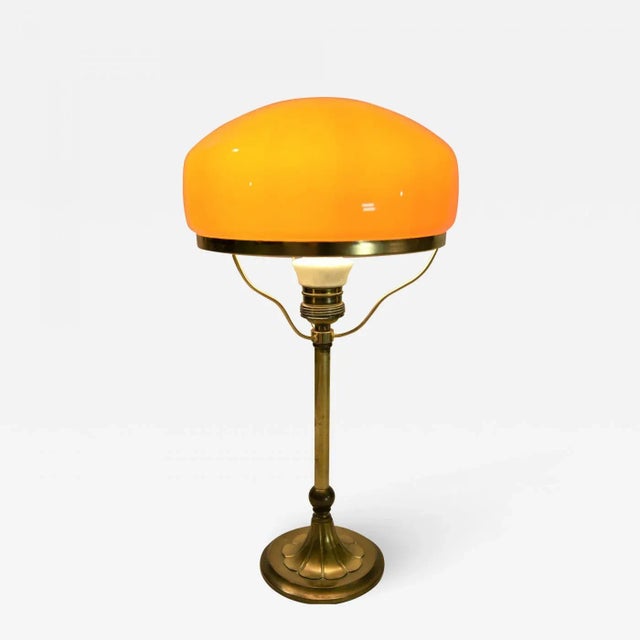 Rare brass and glass table lamp made by Karlskrona Lampfabrik in the late 1920s. The lamp has a typical production four...