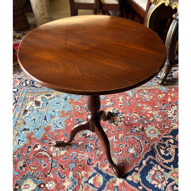 Beautiful and high quality mahogany tripod tilt-top table by Kittinger. Makes a great side table, candle or whiskey stand....
