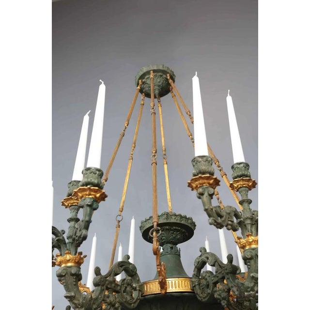 Large and heavy 19th century Empire style chandelier. Elegant palace chandelier that can be used with candles or...