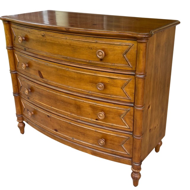 Vintage knotty pine, four drawer chest/commode. Each drawer front features bamboo mouldings, the form of which is echoed...