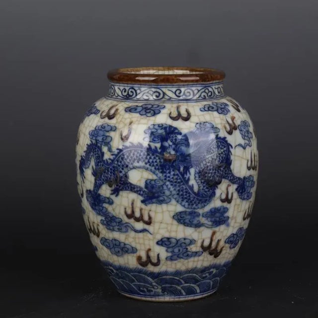 W-16cm,H-20.2cm The product is a vintage Kangxi marked blue and white porcelain jar hand-painted with a cloud and dragon...