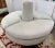 She stunning custom round banquette or sofa, expertly upholstered in luxurious velvet for a soft, inviting feel. Its...