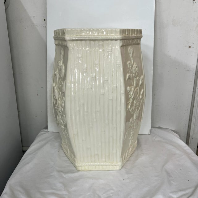 Chinoiserie garden stool with white on white patterned panels of bamboo and florals. Measures 12” diameter x 18” h. Could...