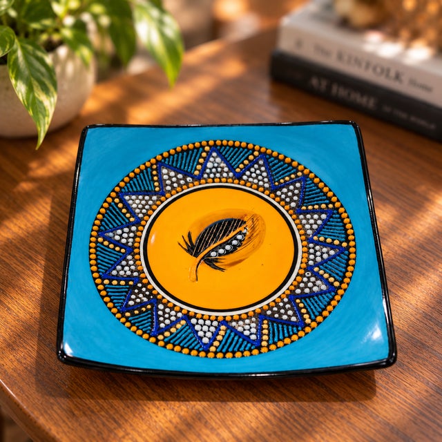 Colorful signed M. Funke studio pottery plate dated 2005, featuring a striking Southwestern-inspired geometric design in...
