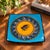 Colorful signed M. Funke studio pottery plate dated 2005, featuring a striking Southwestern-inspired geometric design in...