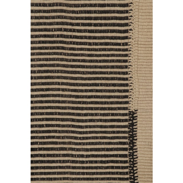 Handwoven in wool, this new 5x7 Rez Kilim showcases a bold striped design in an ivory field. Its minimalist geometric...