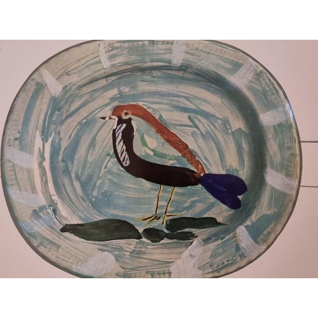 An exquisite shiny polychrome print of Picasso Vallauris ceramic plate depicting a bird. The color print is attached to a...