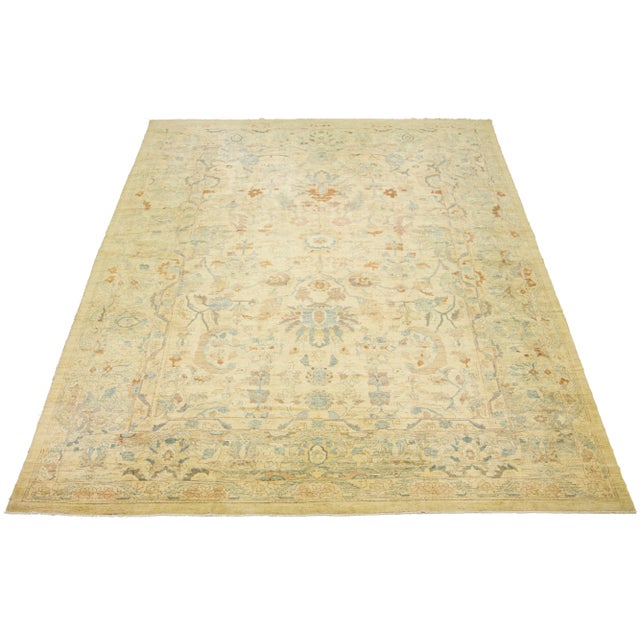 A beautiful, oversized, modern Persian Sultanabad rug is hand-knotted with a beige field. This collection is made of wool...