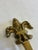 A beautifully cast vintage solid brass wall hook featuring an ornate Fleur-de-Lis backplate and a substantial curved hook....
