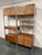 Exceptional vintage Mid-Century Modern two-section wall system by Founders Furniture, combining architectural design,...