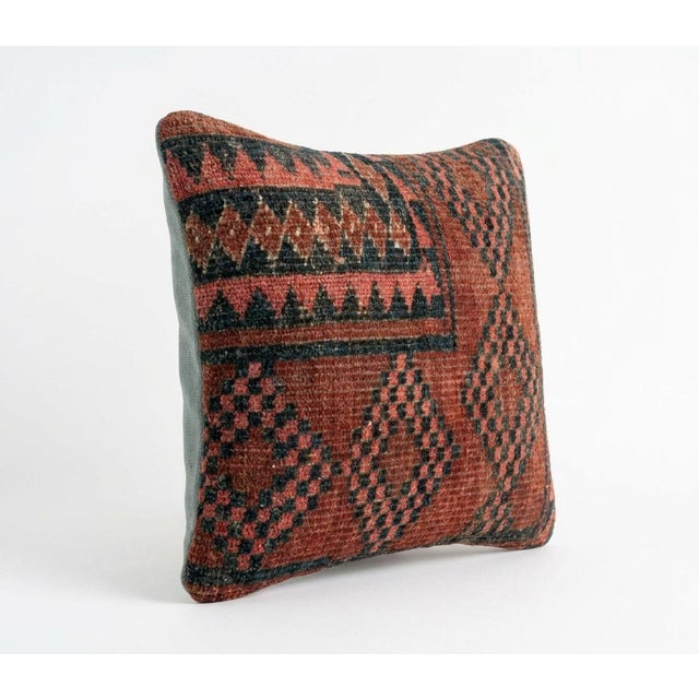 This beautiful 13'' x 13'' pillow cover was made from an authentic Turkish rug. Bright colors of wool adorn the front of...