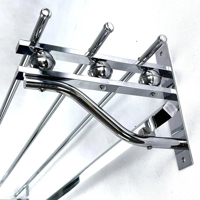 This beautiful French wall coat rack from the 1930s is in the streamline modern Art Deco style. This style emphasized...