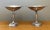 Showcasing graceful proportions and organic naturalistic detailing, this pair of vintage silverplate compote dishes...