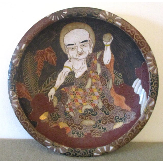 Japanese Edo Period Moriage Slip Pottery Charger showing Deity or Immortal. This was purchased in Occupied Japan in the...