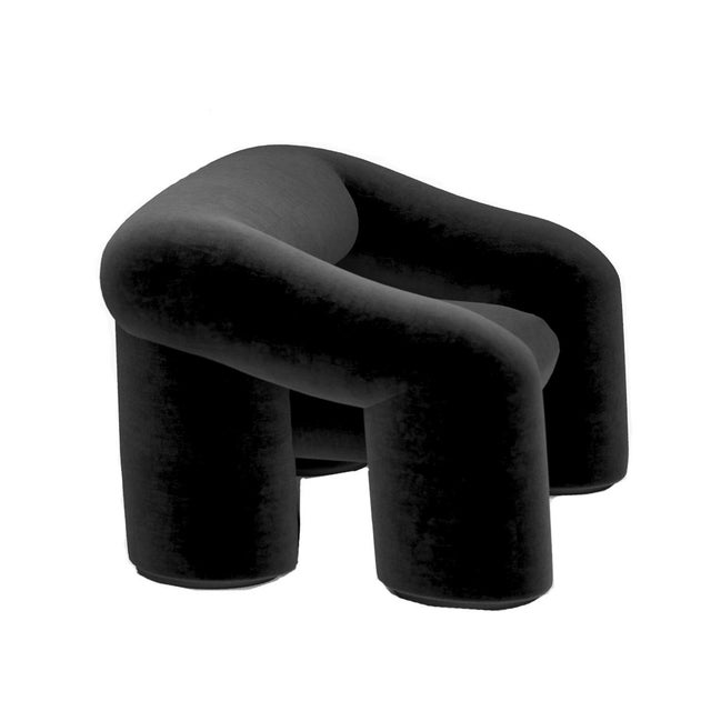 A comfortable and spacious chair with a unique design and voluminous shapes.