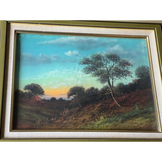 Framed vintage landscape of sunrising or sunsetting. Sky sun is almost a chrome color. The landscape has a beautiful...