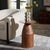 Transform your living space with the Karu Accent Table in elegant walnut. This beautifully designed piece seamlessly...