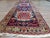 Handmade Antique Persian Style Heriz Runner Rug Add a touch of history and artistry to your home with this handmade...