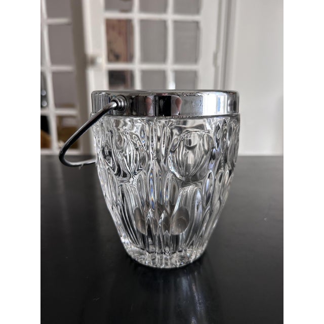 Set of two 1970s cut crystal and silver-plated metal buckets. Tongs and spoon included. Small bucket: Height 13cm, Width...