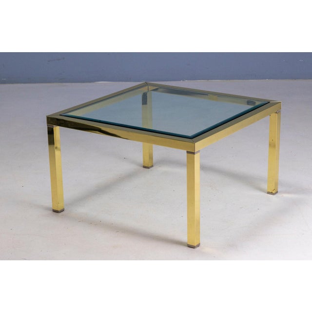 This coffee table dates to the 1970s and reflects the refined aesthetic of European interior design of the period. The...