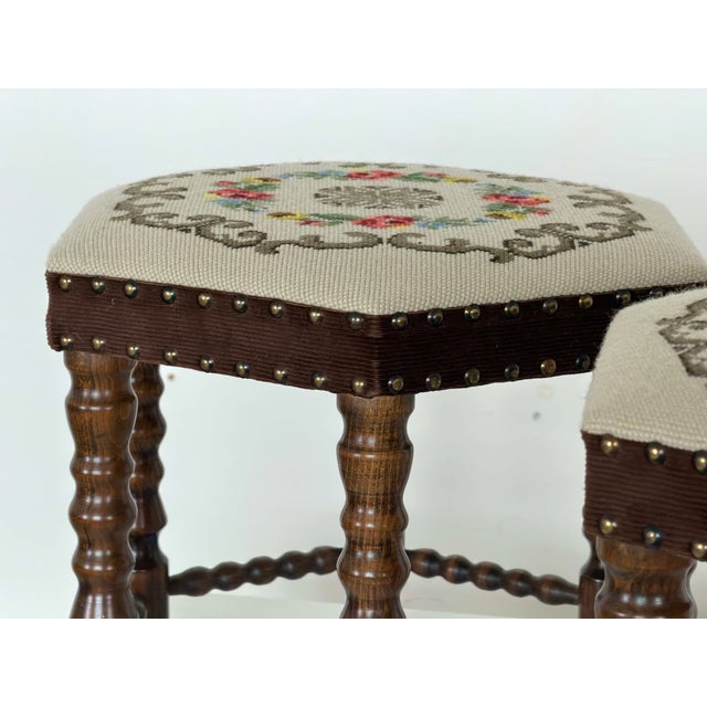 This hexagonal stools is upholstered in a hand-worked needlepoint tapestry, dated to the 1950s. Each top depicts a central...