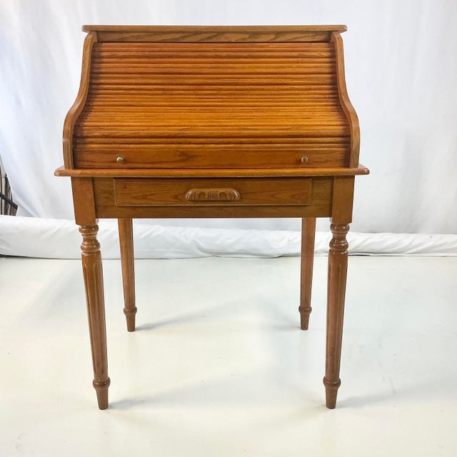 This is a nice size desk for an apartment or small room. It’s from the Mid-Century and features four Neoclassical styled...