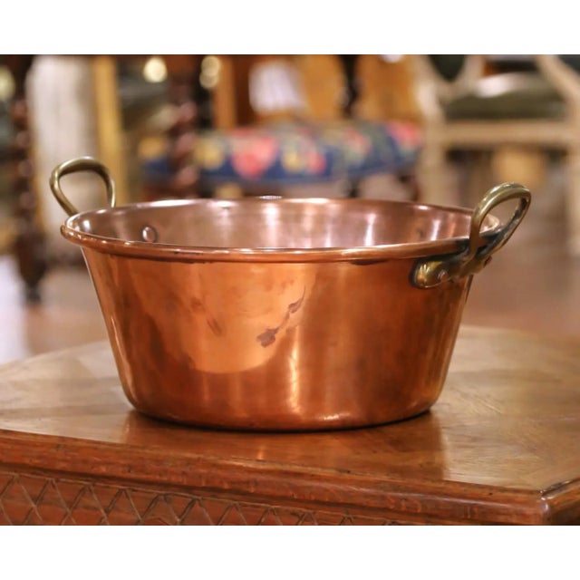 Bring a touch of authentic French countryside charm to your kitchen with this large early 20th-century copper marmalade...