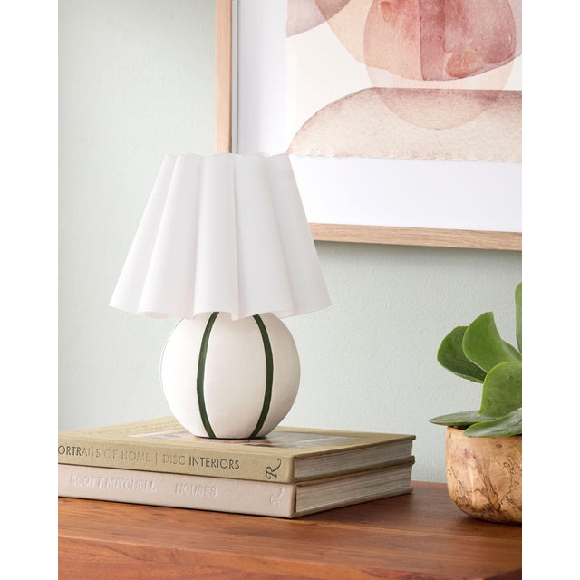 Illuminate your space with the Kinki accent table lamp, a captivating blend of Arts & Crafts Traditional style that...