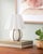 Illuminate your space with the Kinki accent table lamp, a captivating blend of Arts & Crafts Traditional style that...
