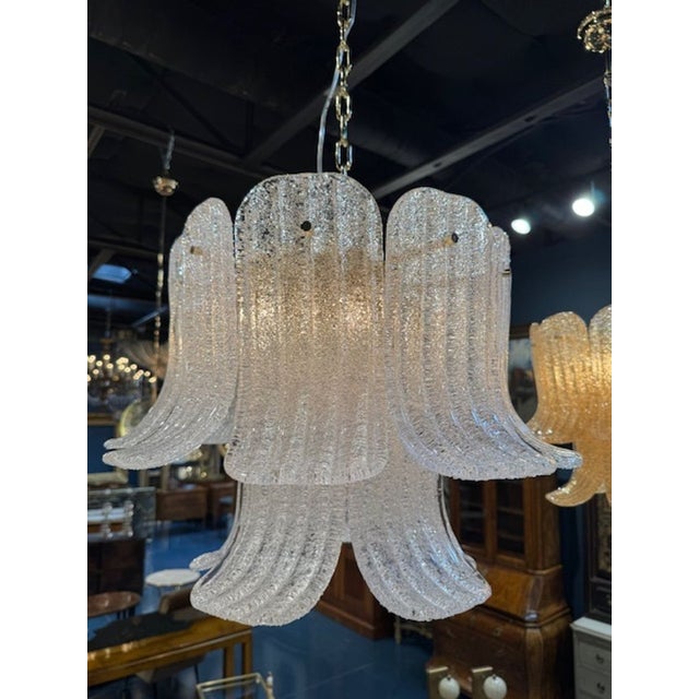 Pretty modern Murano clear granola glass bell shape chandelier. Murano bell chandeliers are hand‑blown Venetian glass...