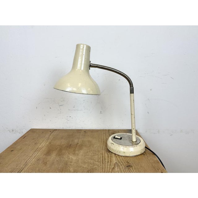 Industrial adjustable workshop table lamp made by Polam Wilkasy in Poland during the 1960s. It features an aluminium...