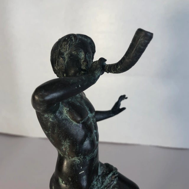 Great Maitland Smith Bronze Figure of a Male Playing what Appears to be a Horn, Bugle, or Trumpet, while standing on a...
