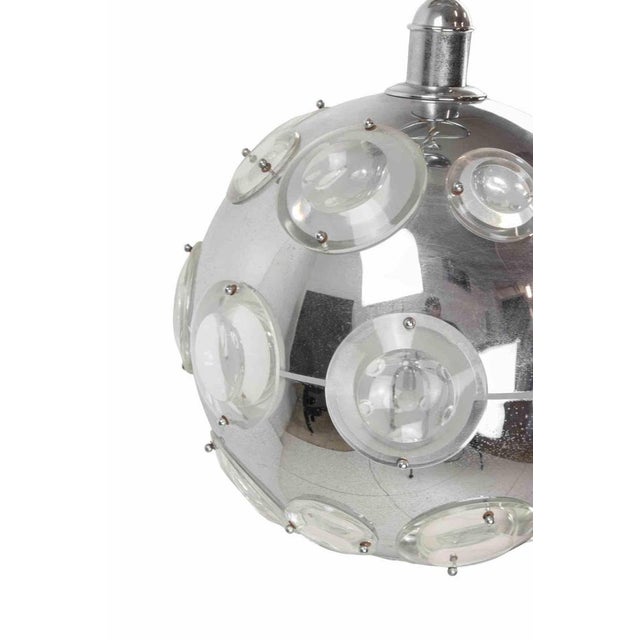 Vintage pendant lamp by Oscar Torlasco, realized in Italy in 1970s. Chromed metal structure and glass lens diffusers. Very...