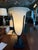 A vintage Haig table lamp featuring a carved alabaster urn with bronze accents supported by bronze accents and a...
