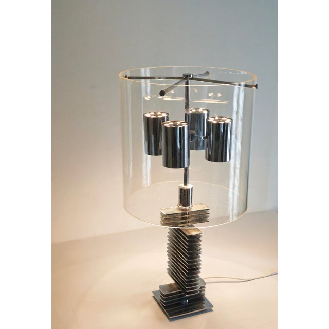 Rare, unique, and exceptional, this large chrome table lamp features an acrylic glass shade. Interior designers, i invite...
